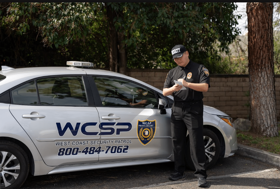 Guard reviewing a building exterior wall and windows