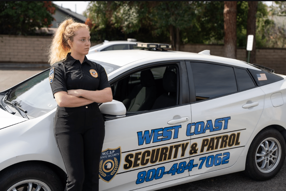 Guard patrolling a property exterior at dusk